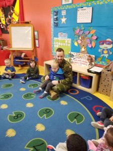Canadian solder with toddler