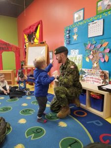 Canadian soldier with toddlers