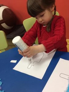 Toddler with a dreidel image