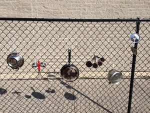 kitchen equipment on a chain fence