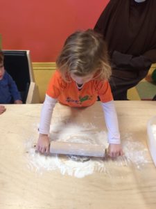 Kid rolling cookie dough