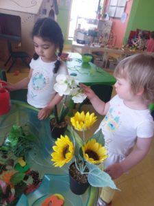 Kids touching a flower 