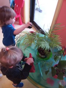 Children playing with plants