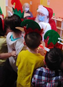 Santa greeting toddlers at Tiny Hoppers