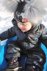 Toddler playing in the snow