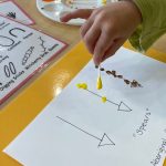 Toddler pointing at drawing of an arrow