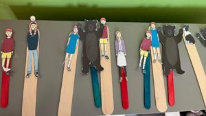 Popsickle sticks with bears and people on them