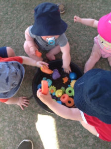 lots of babies playing with toys in the water