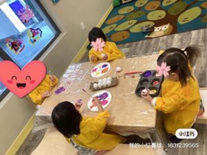 Children making Easter hand crafts
