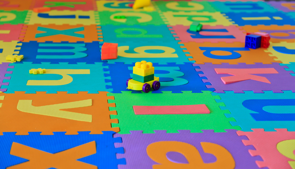 Colourful puzzle floor pieces and toys